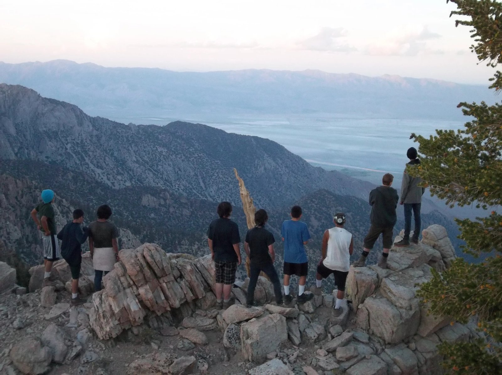 Pyles campers standing on a rocky overlook in the mountains